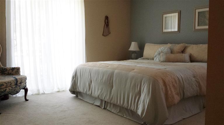 87 Sterling Road Hyannis, MA 02601 - Photo 23 of 31 a bedroom with a bed and a chair