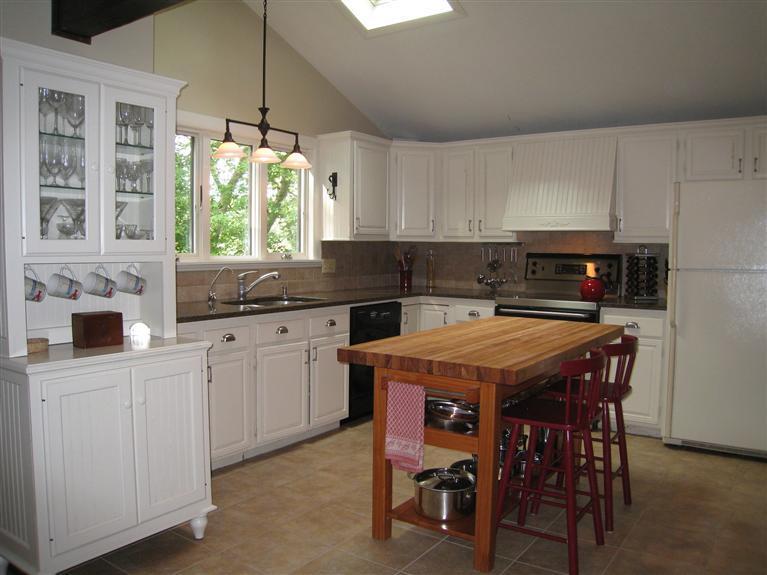 87 Sterling Road Hyannis, MA 02601 - Photo 6 of 31 a kitchen with a table chairs and a window