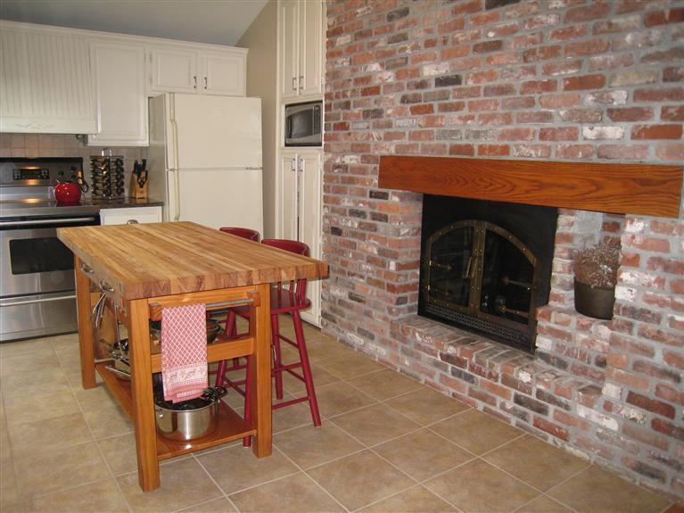87 Sterling Road Hyannis, MA 02601 - Photo 7 of 31 a kitchen with a cabinets and a fireplace