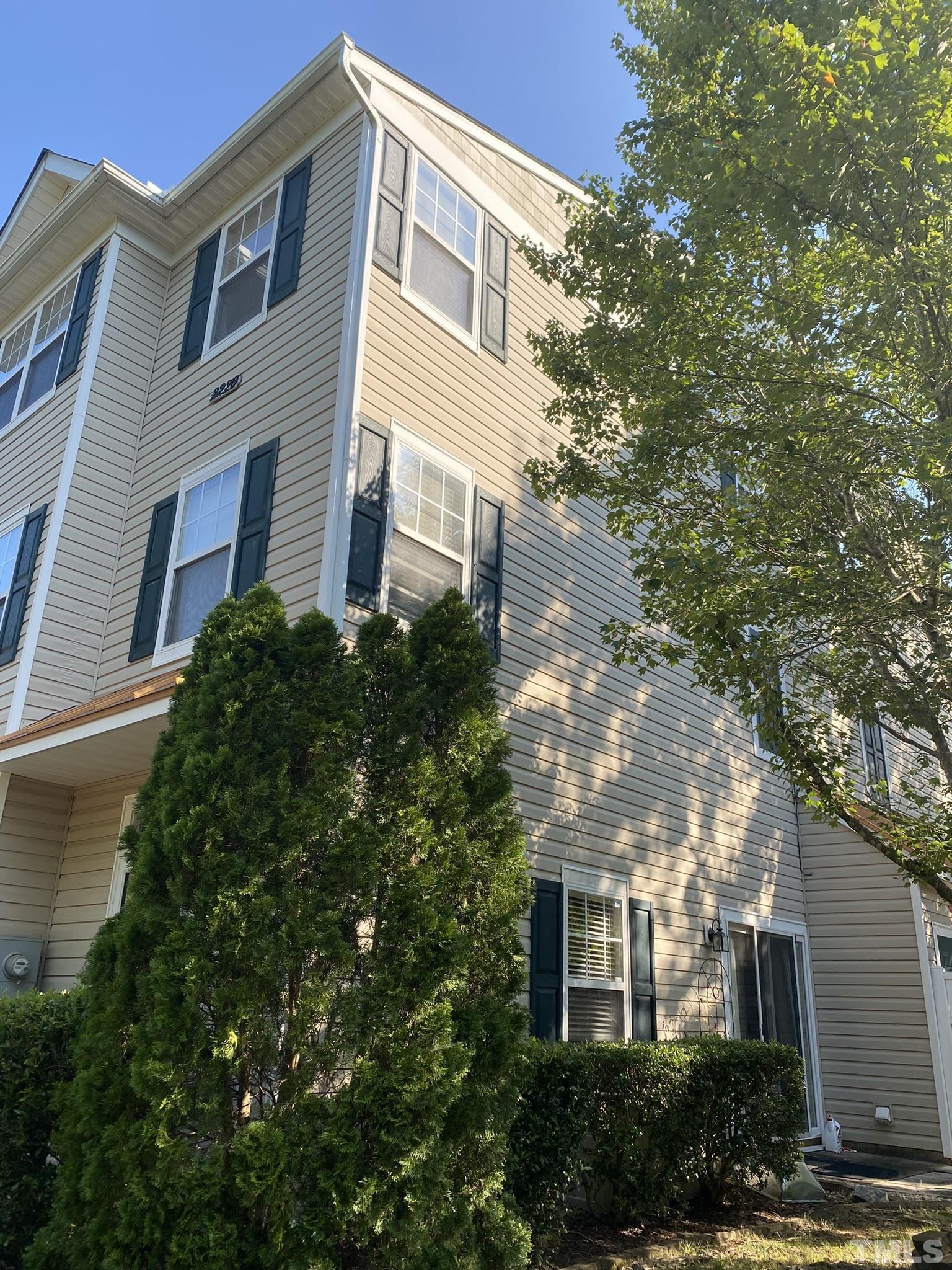 2220 Raven Road, Unit 101 Raleigh, NC 27614 - Photo 2 of 26 a front view of a house with plants and trees