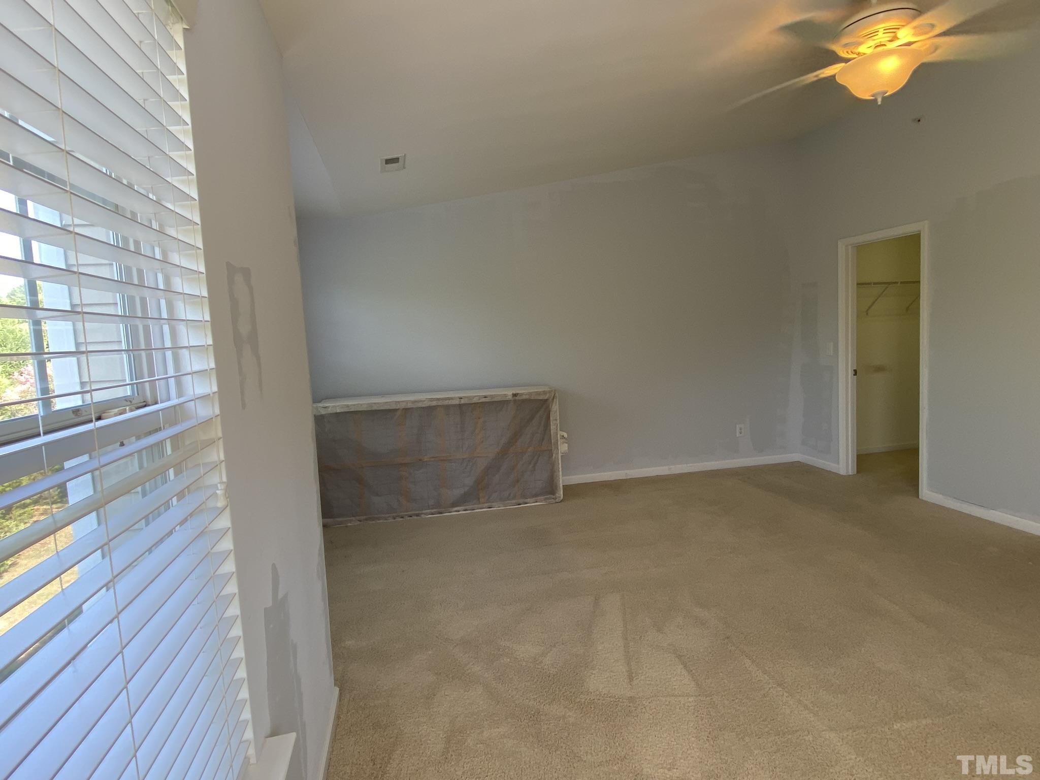 2220 Raven Road, Unit 101 Raleigh, NC 27614 - Photo 23 of 26 a view of an empty room and wooden floor