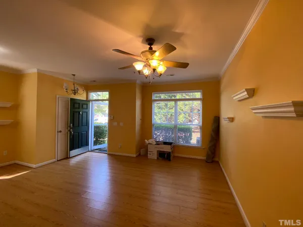 a view of an empty room with a window