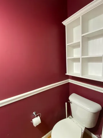 a bathroom with a toilet and a sink