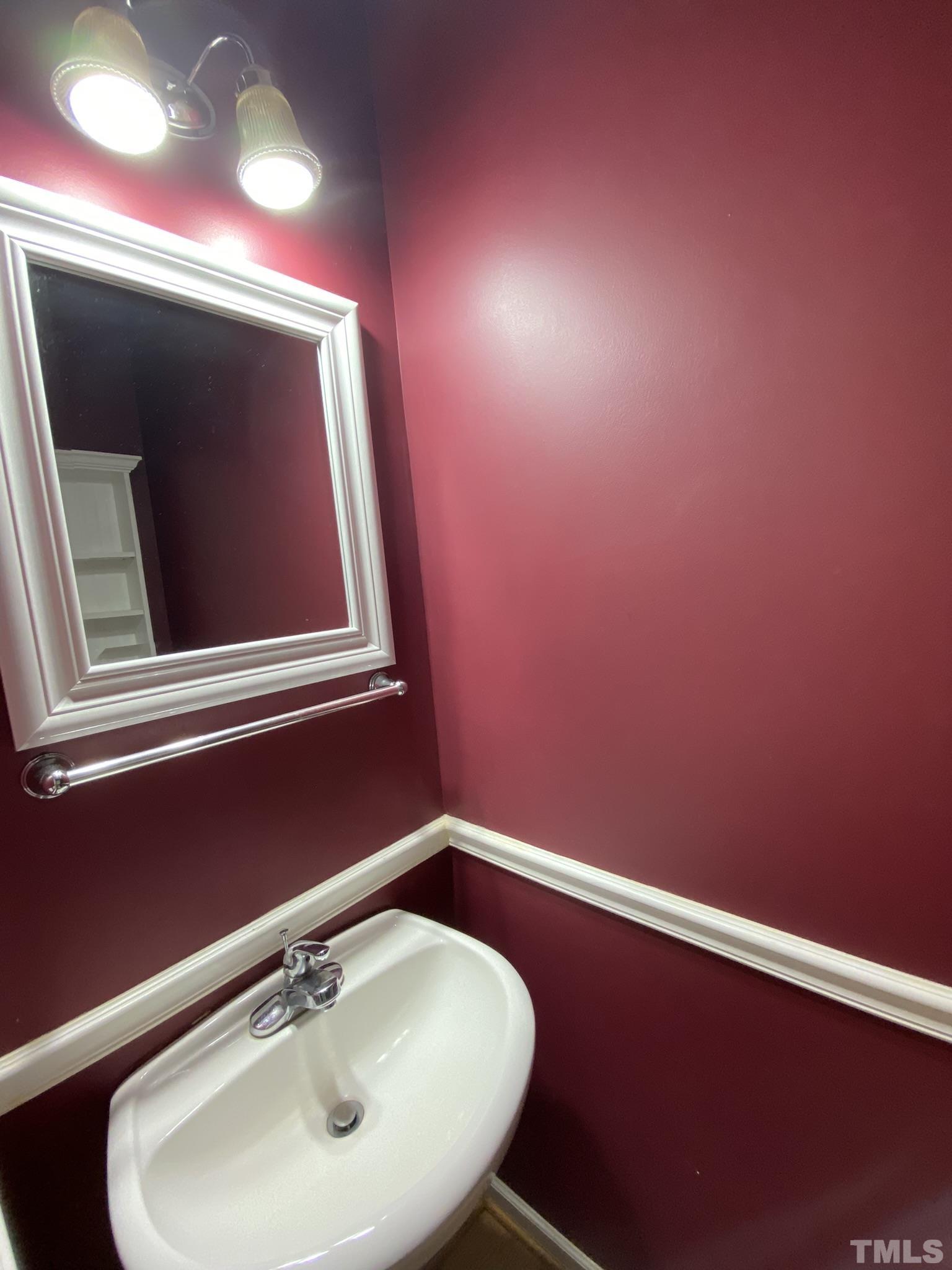 2220 Raven Road, Unit 101 Raleigh, NC 27614 - Photo 10 of 26 a bathroom with a sink and a mirror