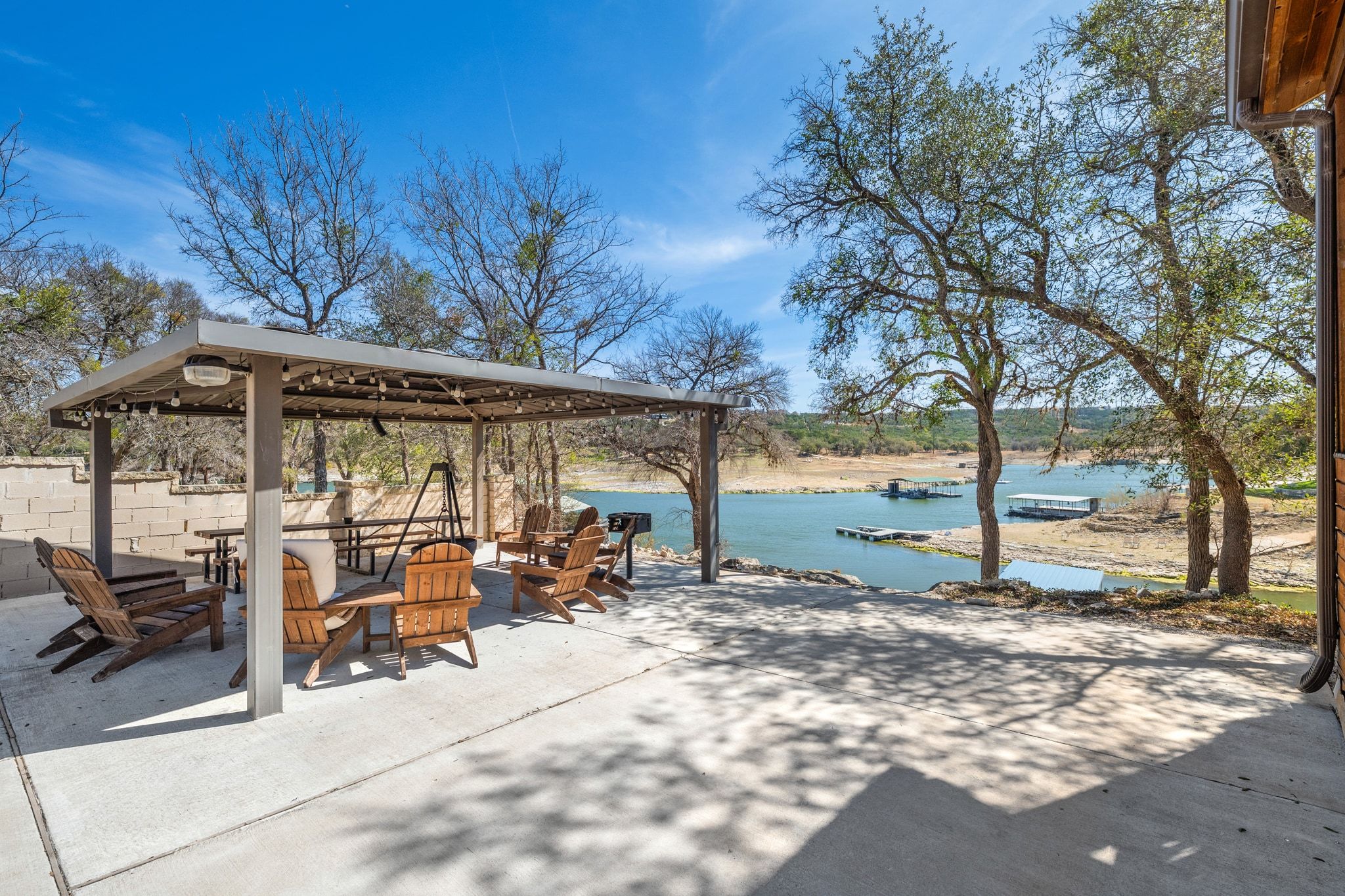 2903 Oak Ridge Drive Spicewood, TX 78669 - Photo 1 of 33 Covered Pavilion amenity on a beautiful waterfront lot on Lake Travis, with a Main House + Guest House located just outside of Lakeway, in Spicewood.