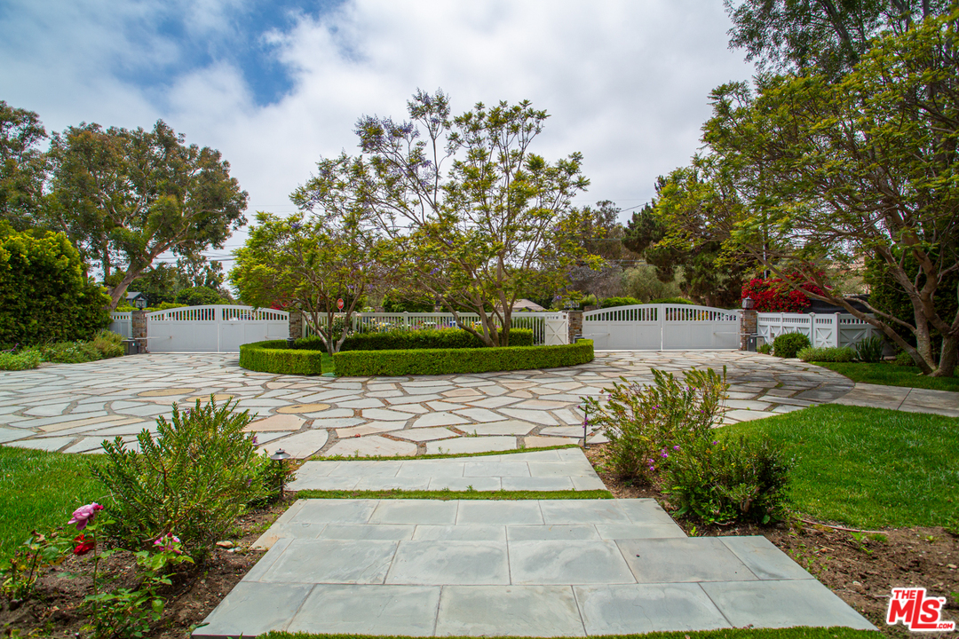 6692 Wildlife Road Malibu, CA 90265 - Photo 2 of 37 a view of a yard with flowers and trees