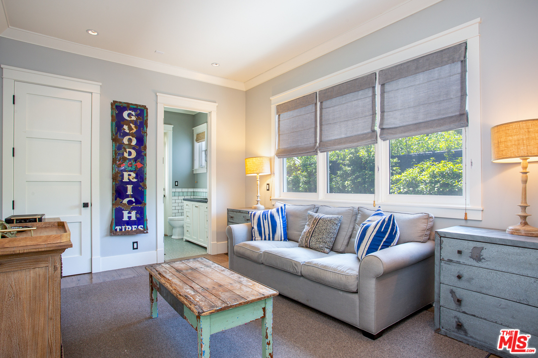 6692 Wildlife Road Malibu, CA 90265 - Photo 13 of 37 a living room with furniture and window
