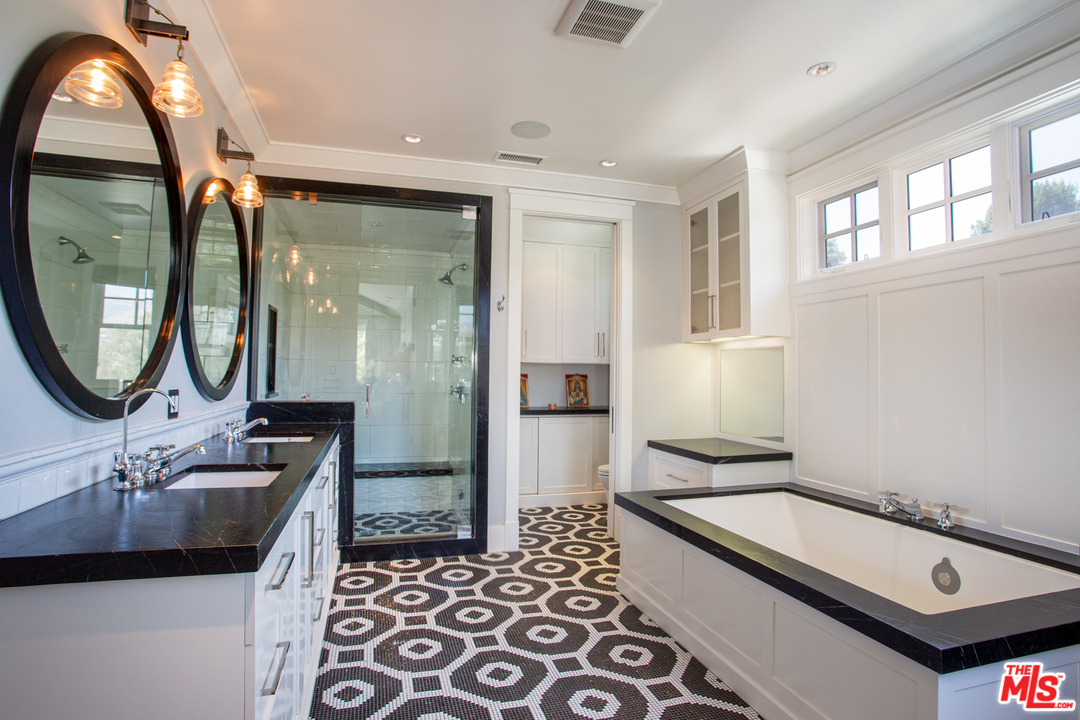 6692 Wildlife Road Malibu, CA 90265 - Photo 19 of 37 a bathroom with a sink a mirror and a shower