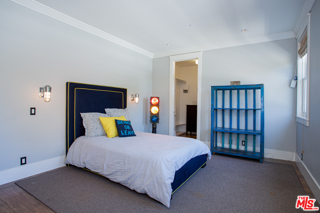 6692 Wildlife Road Malibu, CA 90265 - Photo 20 of 37 a bed sitting in a bedroom next to a window