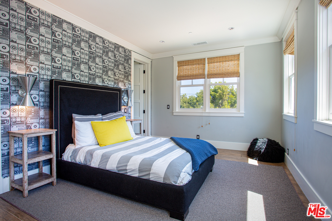 6692 Wildlife Road Malibu, CA 90265 - Photo 23 of 37 a bedroom with a bed and a tv