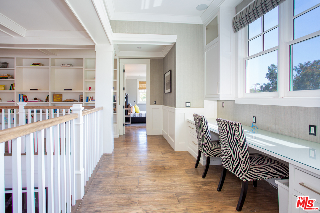 6692 Wildlife Road Malibu, CA 90265 - Photo 24 of 37 a view of a dining room with furniture and wooden floor