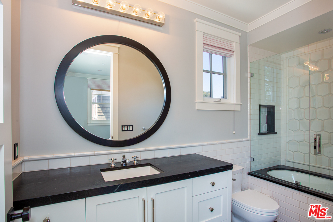 6692 Wildlife Road Malibu, CA 90265 - Photo 26 of 37 a bathroom with a sink and a mirror