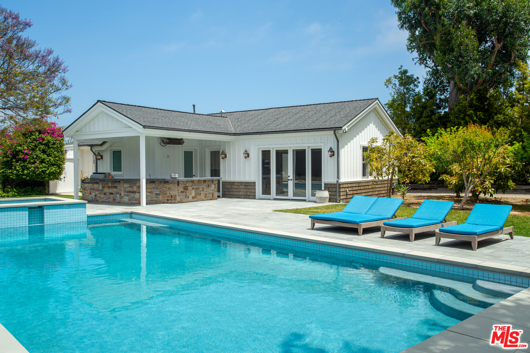 6692 Wildlife Road Malibu, CA 90265 - Photo 34 of 37 a view of an house with swimming pool and porch