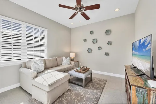 a bathroom with a granite countertop toilet a sink and a mirror