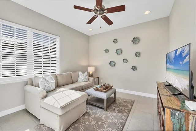 a bathroom with a granite countertop toilet a sink and a mirror