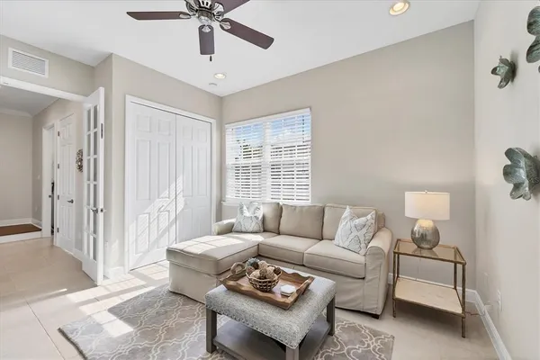 a view of a room with wooden floor and staircase