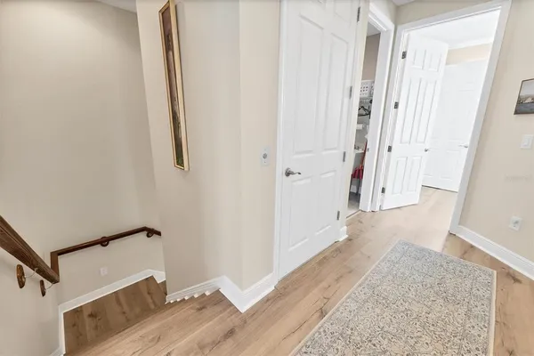 a spacious bedroom with a bed and a table