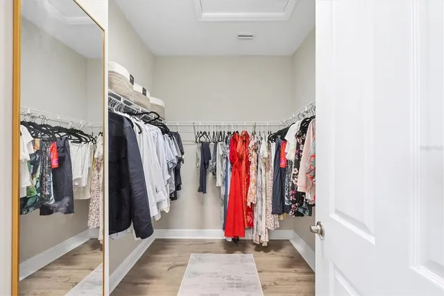 a white bath tub sitting next to a white toilet