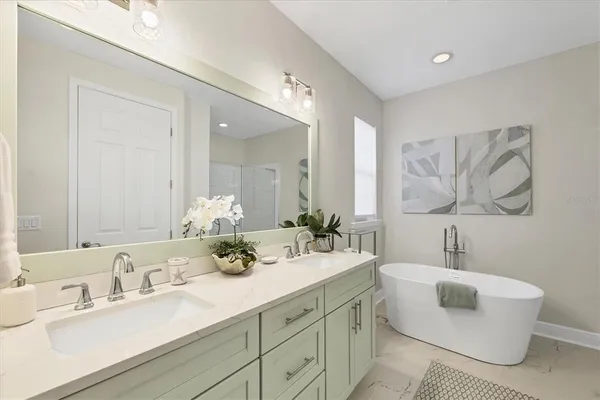 a bathroom with a sink and mirror with toilet