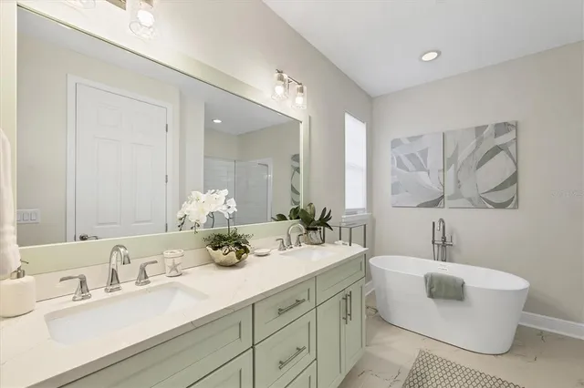 a bathroom with a sink and mirror with toilet