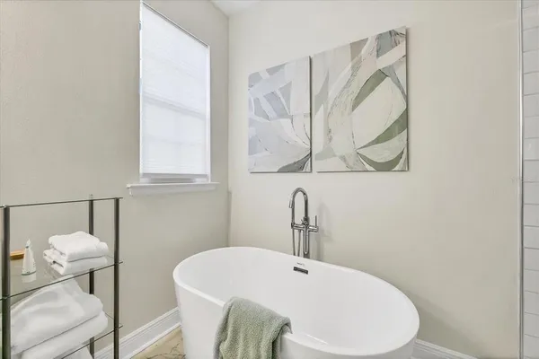 a bathroom with a granite countertop sink toilet a mirror and shower