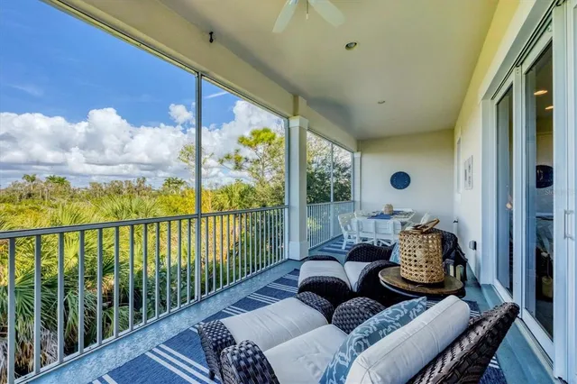 a aerial view of a house with a yard and potted plants