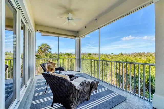 an aerial view of a house with a lake view