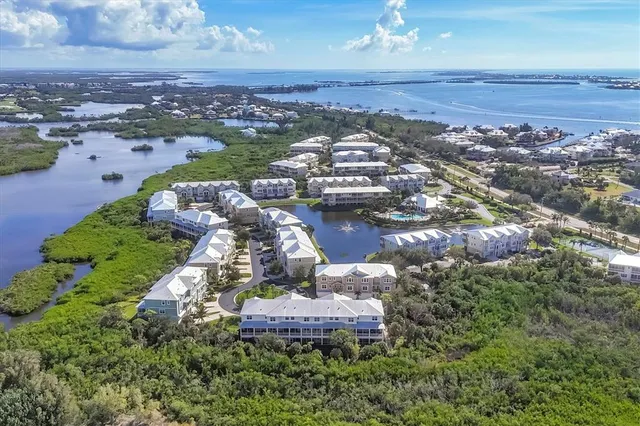 a living room with furniture fireplace and a large window