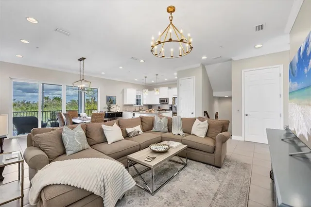 a living room with furniture a couch and a window