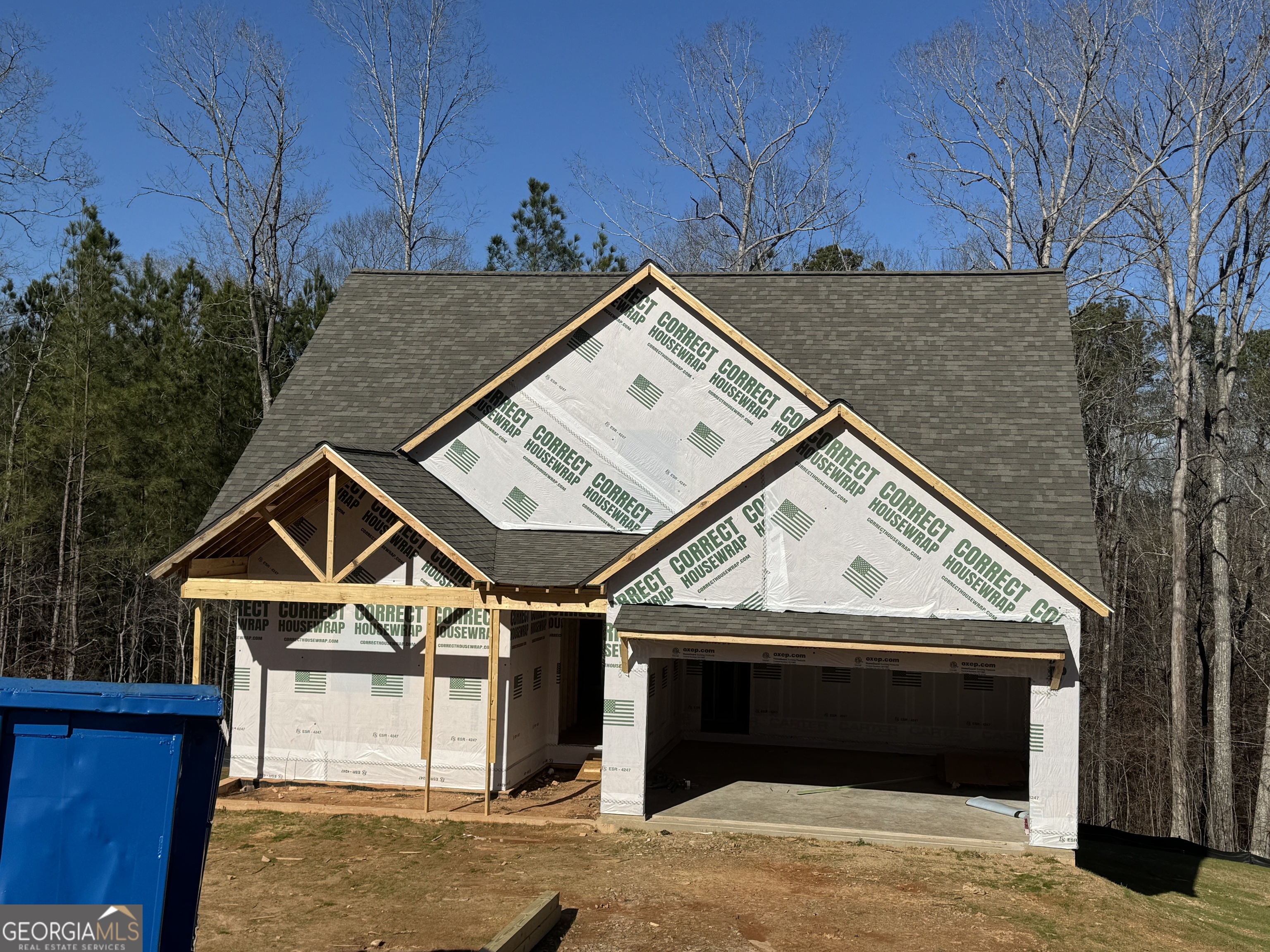 70 Lloyd Street Monticello, GA 31064 - Photo 1 of 16 a view of a house with a flat screen tv and a fireplace