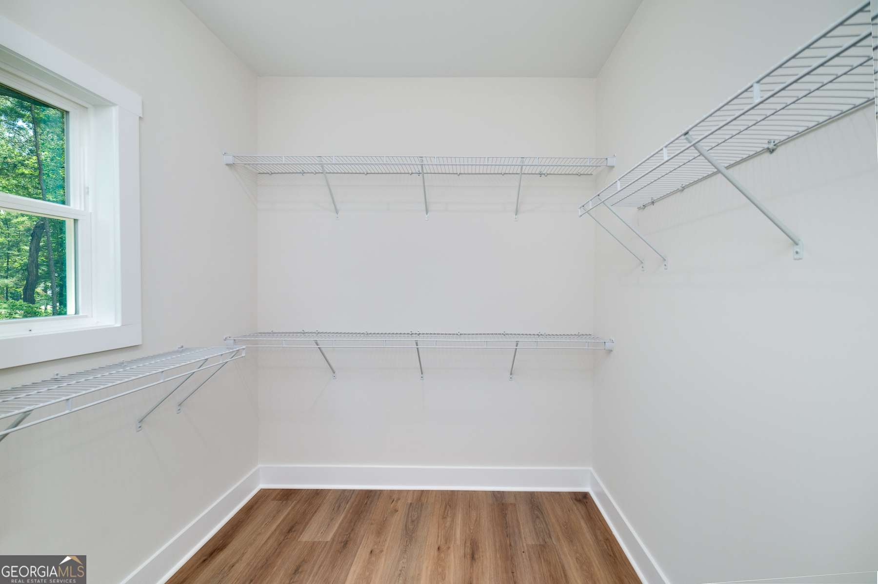 70 Lloyd Street Monticello, GA 31064 - Photo 13 of 16 a view of a room with racks on the wall