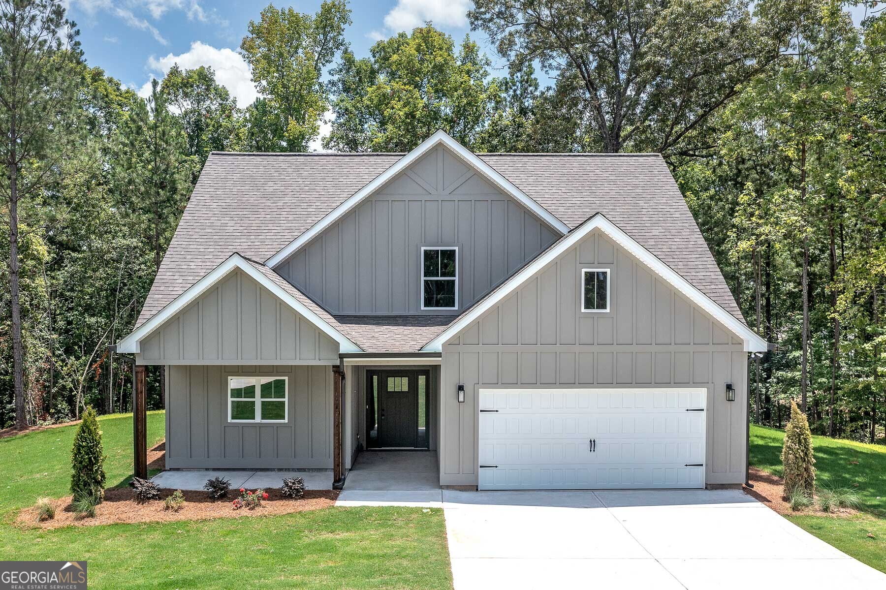 70 Lloyd Street Monticello, GA 31064 - Photo 3 of 16 a view of a back yard of the house