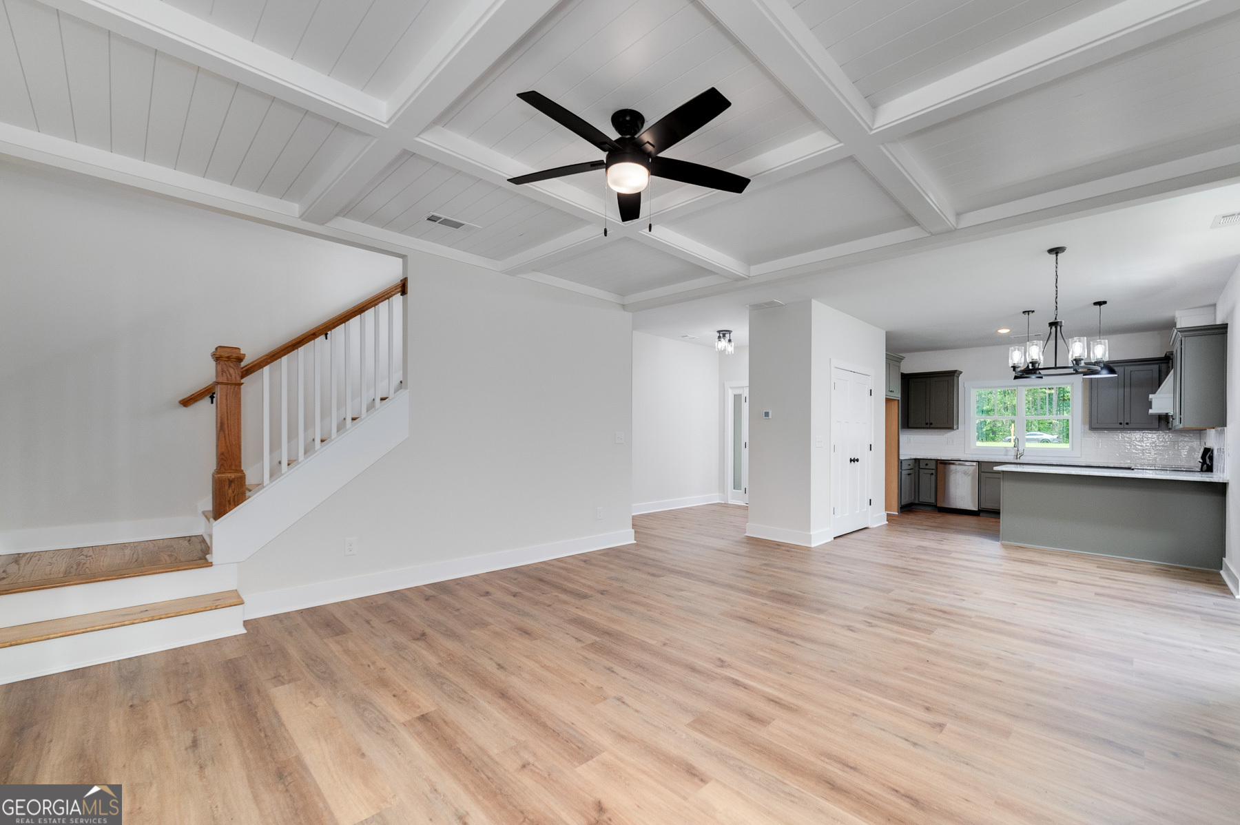 70 Lloyd Street Monticello, GA 31064 - Photo 10 of 16 a view of empty room with wooden floor and ceiling fan