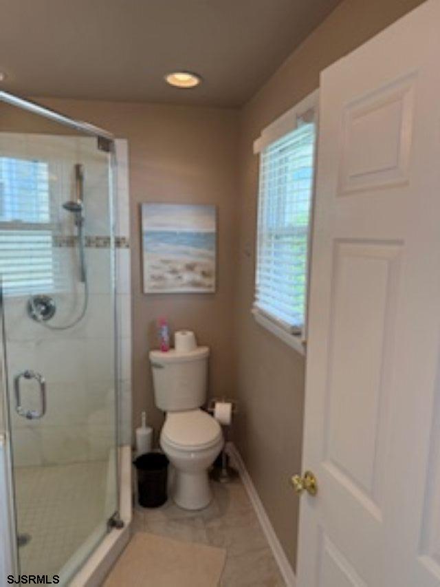 131 North Yarmouth Avenue, Unit JUNE 2026 Longport, NJ 08403 - Photo 16 of 18 a bathroom with a toilet sink and shower