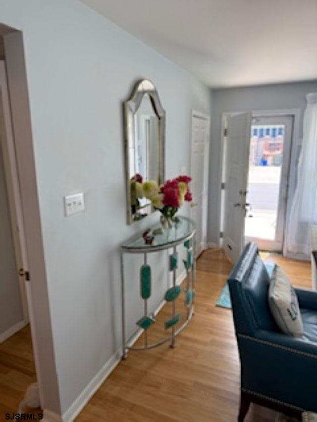 131 North Yarmouth Avenue, Unit JUNE 2026 Longport, NJ 08403 - Photo 2 of 18 a living room with furniture and wooden floor