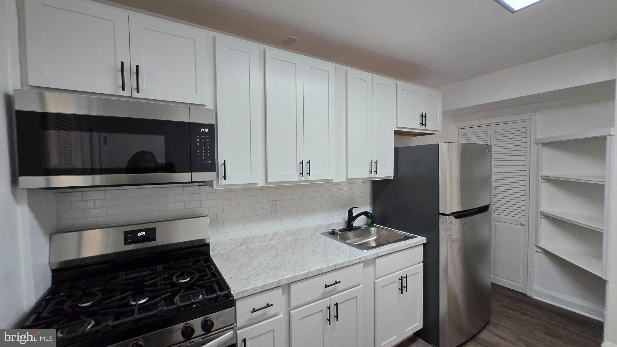 3820 Elkader Road Baltimore, MD 21218 - Photo 9 of 41 Modern kitchen with sleek finishes.