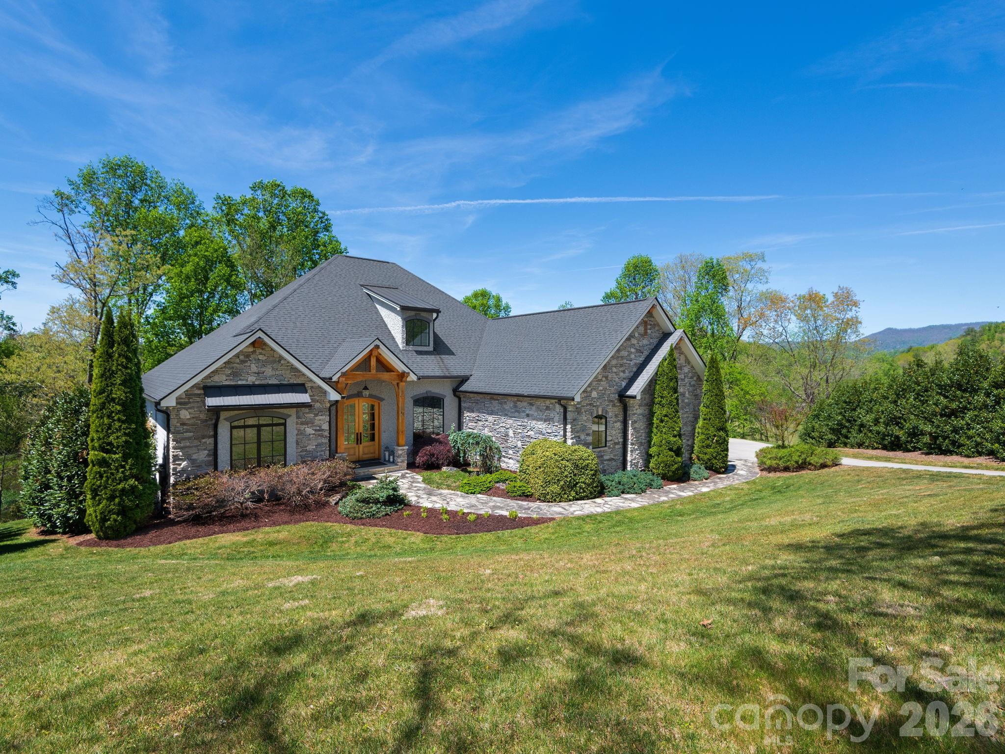 28 Falling Star Court Fletcher, NC 28732 - Photo 1 of 33 a view of a house with a big yard plants and large trees