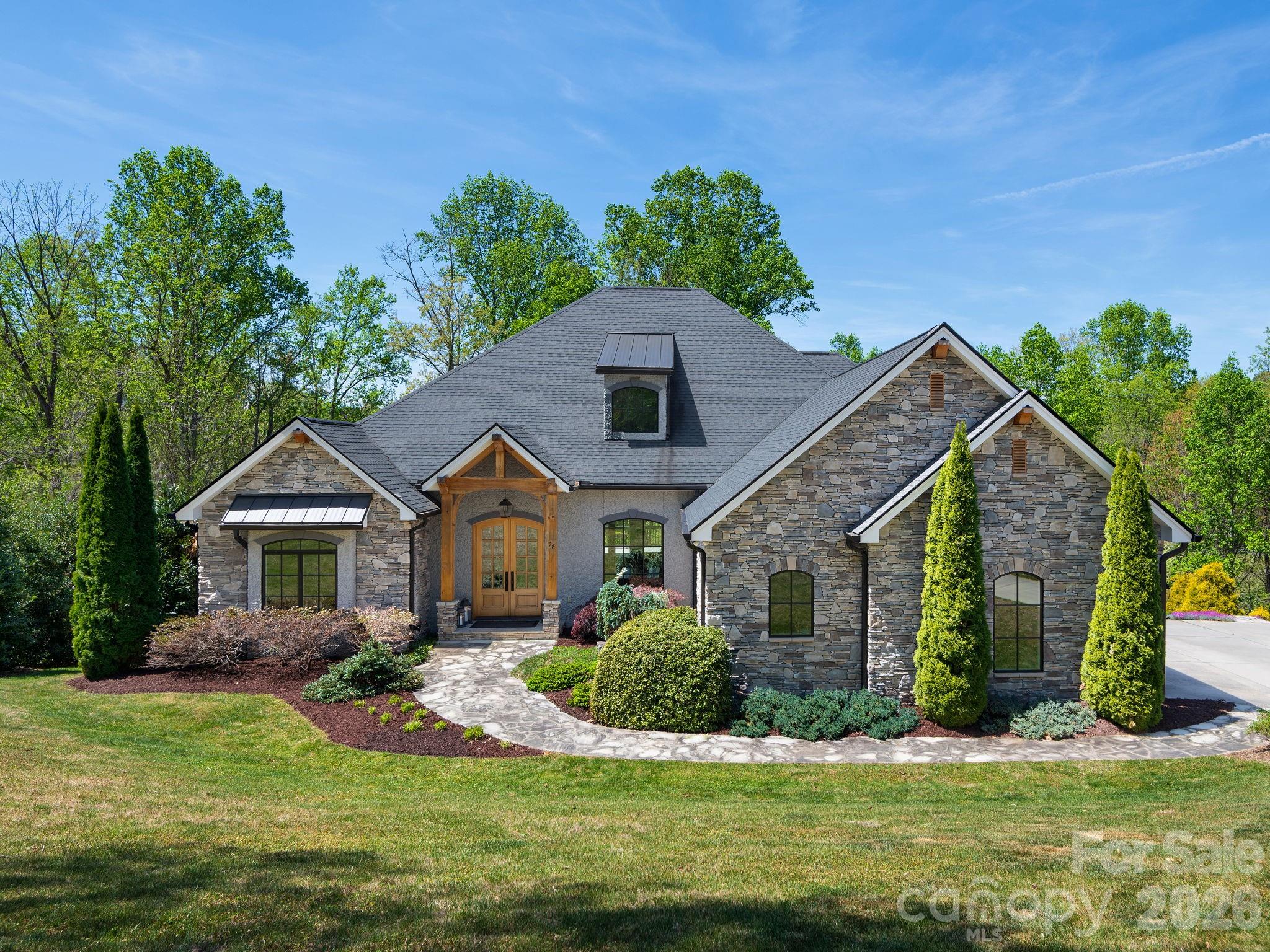 28 Falling Star Court Fletcher, NC 28732 - Photo 2 of 33 a front view of a house with a yard