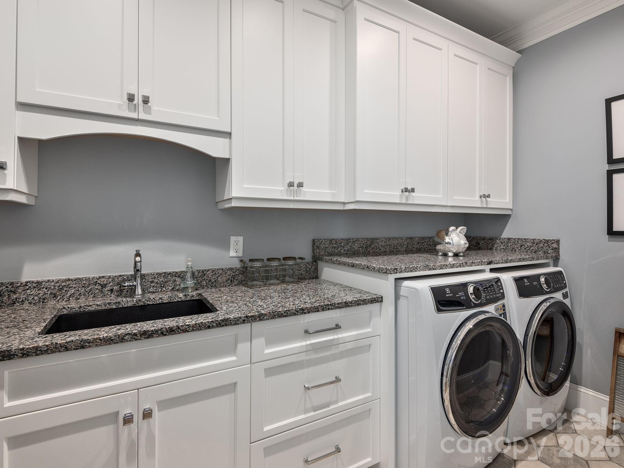 28 Falling Star Court Fletcher, NC 28732 - Photo 22 of 33 a kitchen with granite countertop white cabinets and sink