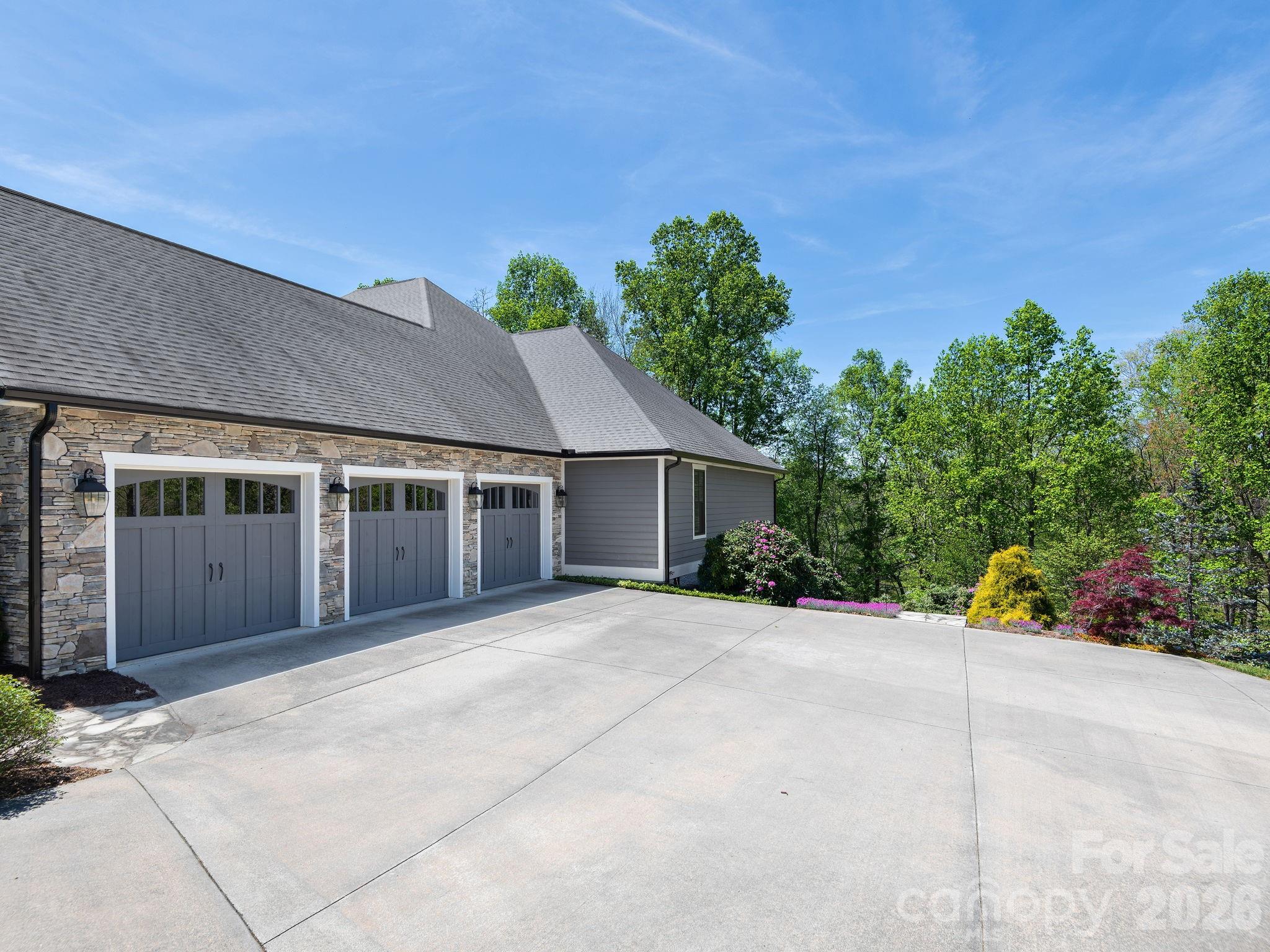 28 Falling Star Court Fletcher, NC 28732 - Photo 24 of 33 a front view of a house with a yard and potted plants