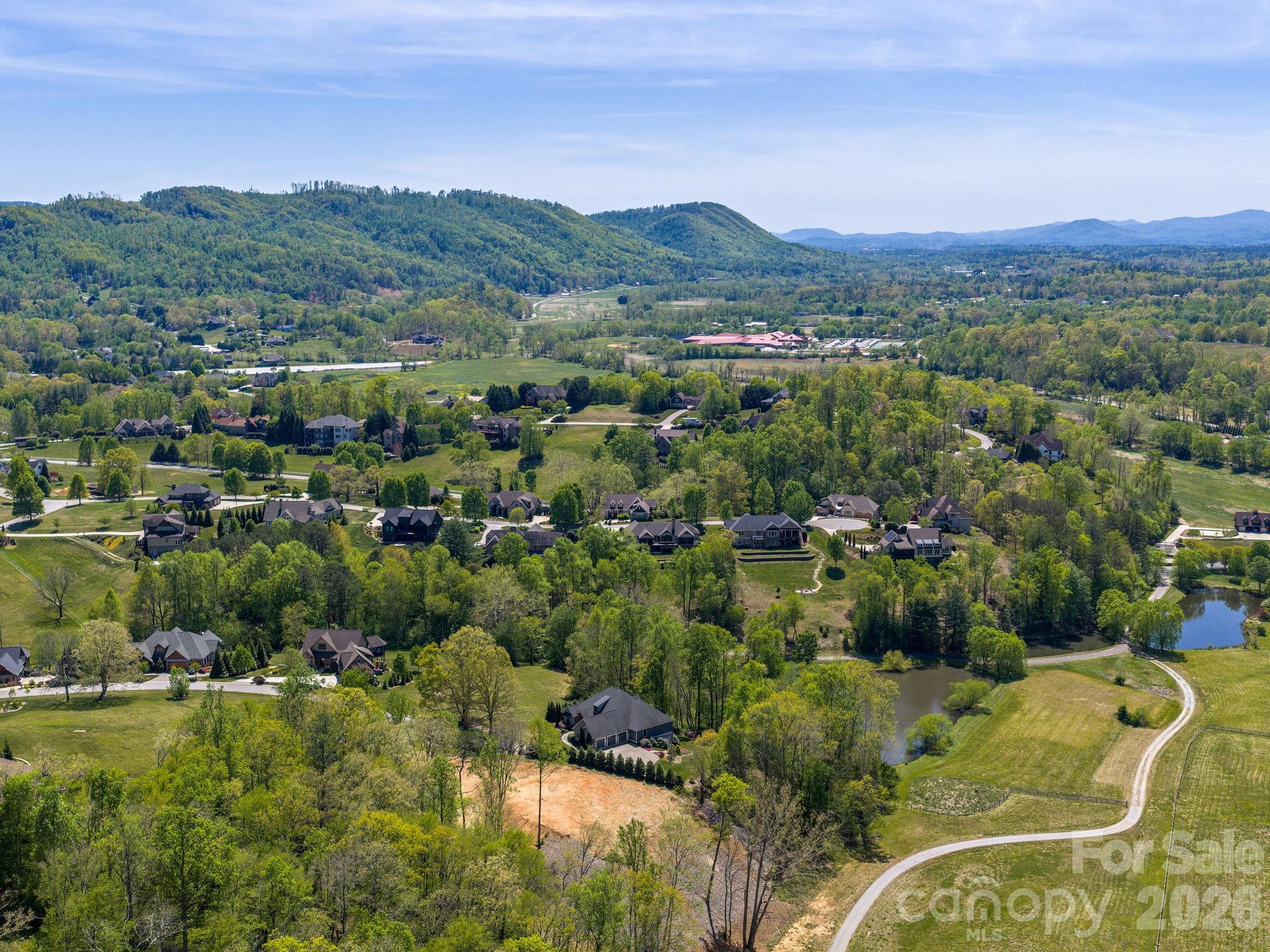 28 Falling Star Court Fletcher, NC 28732 - Photo 30 of 33 a view of a city with lush green forest