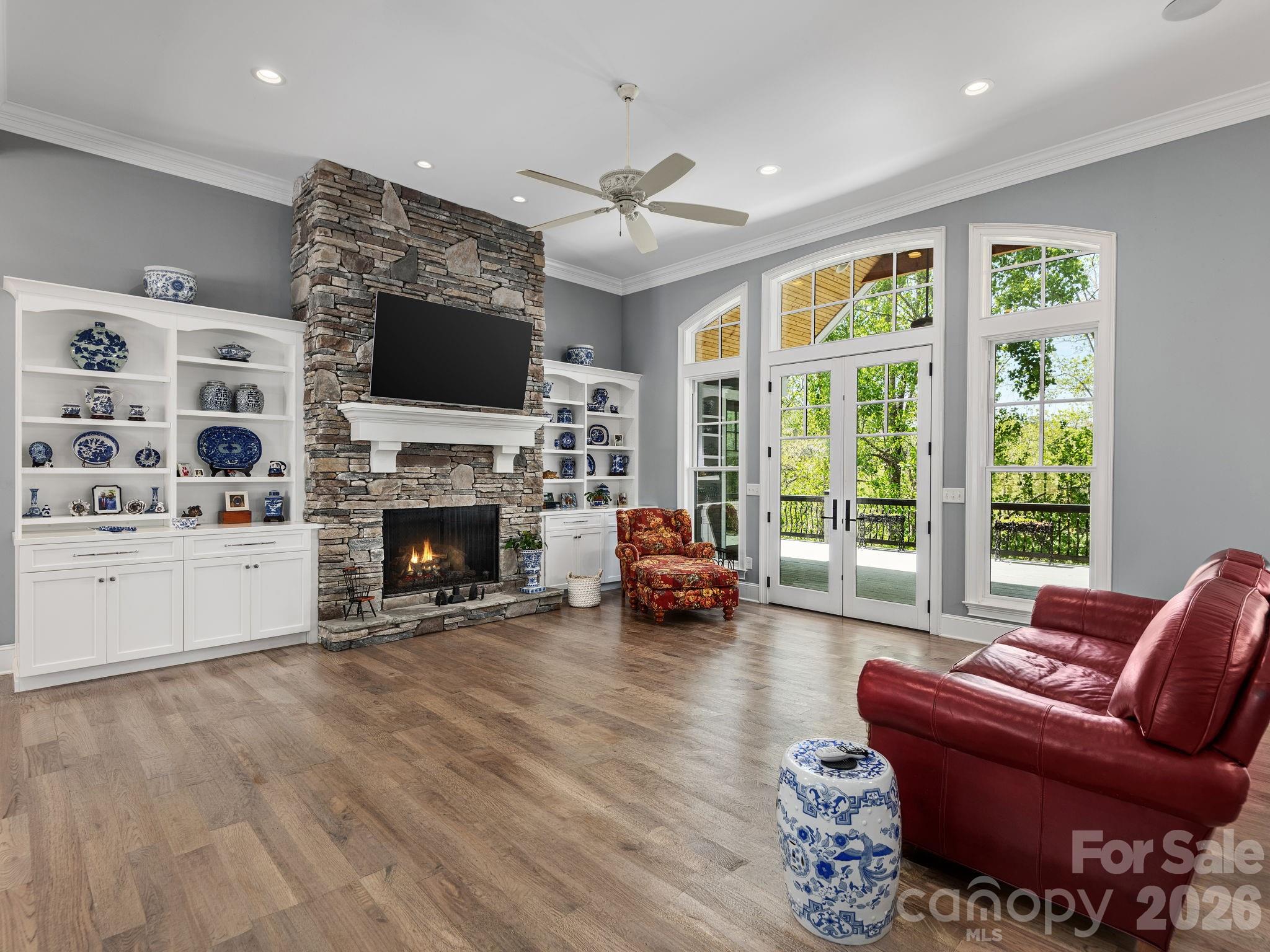 28 Falling Star Court Fletcher, NC 28732 - Photo 5 of 33 a living room with furniture a flat screen tv and a fireplace
