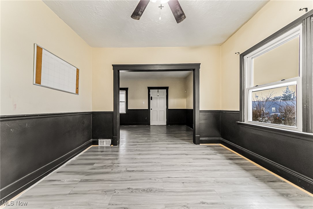 2014 Cook Avenue Cleveland, OH 44109 - Photo 6 of 37 Corridor featuring light wood-type flooring and a textured ceiling