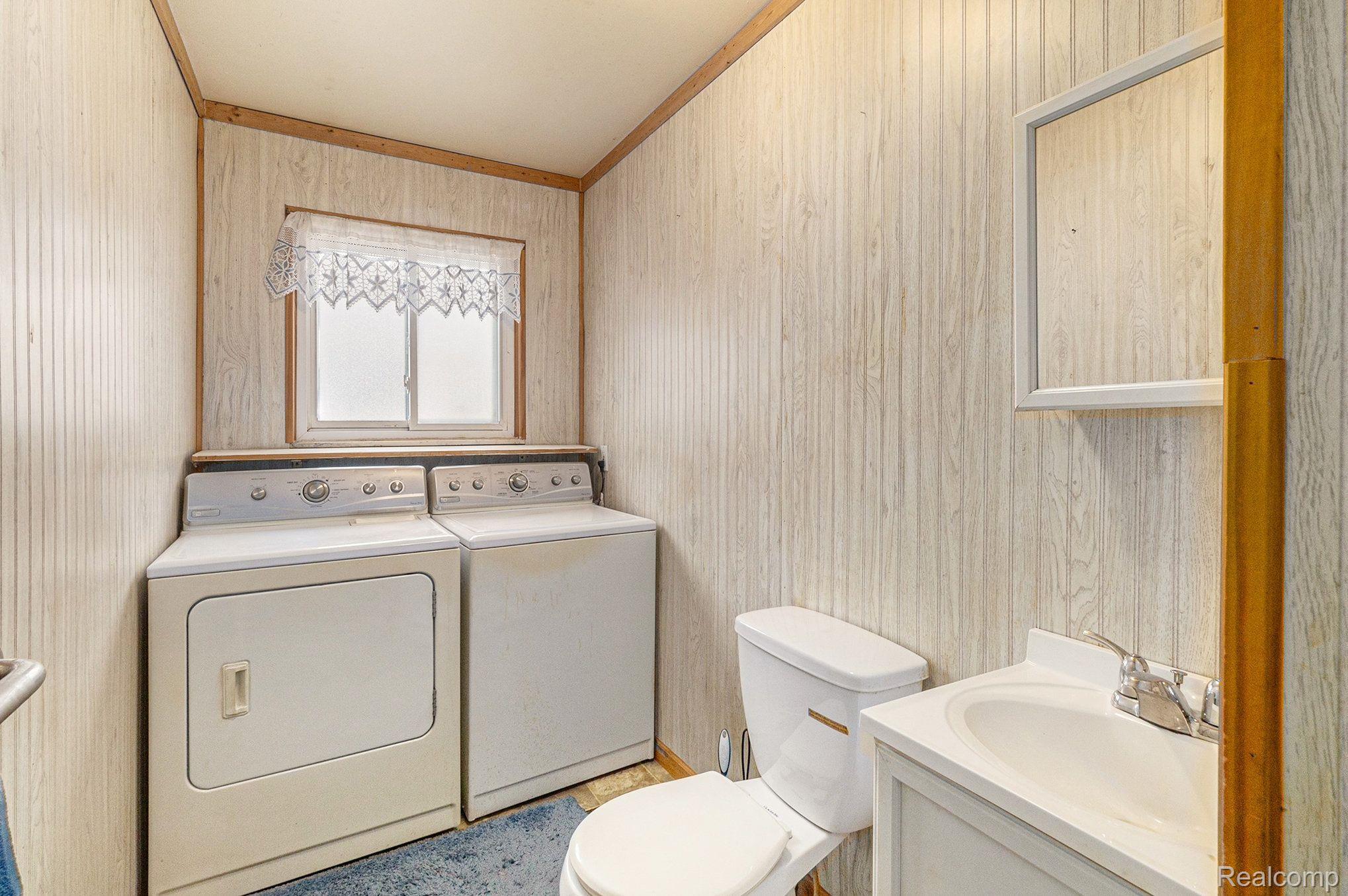1726 Peavy Road Howell, MI 48843 - Photo 14 of 43 1st Floor laundry and half bath
