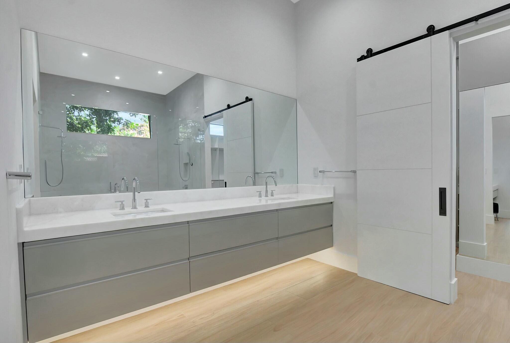 1470 Northeast 4th Avenue Boca Raton, FL 33432 - Photo 37 of 86 a bathroom with a double vanity sink mirror and shower
