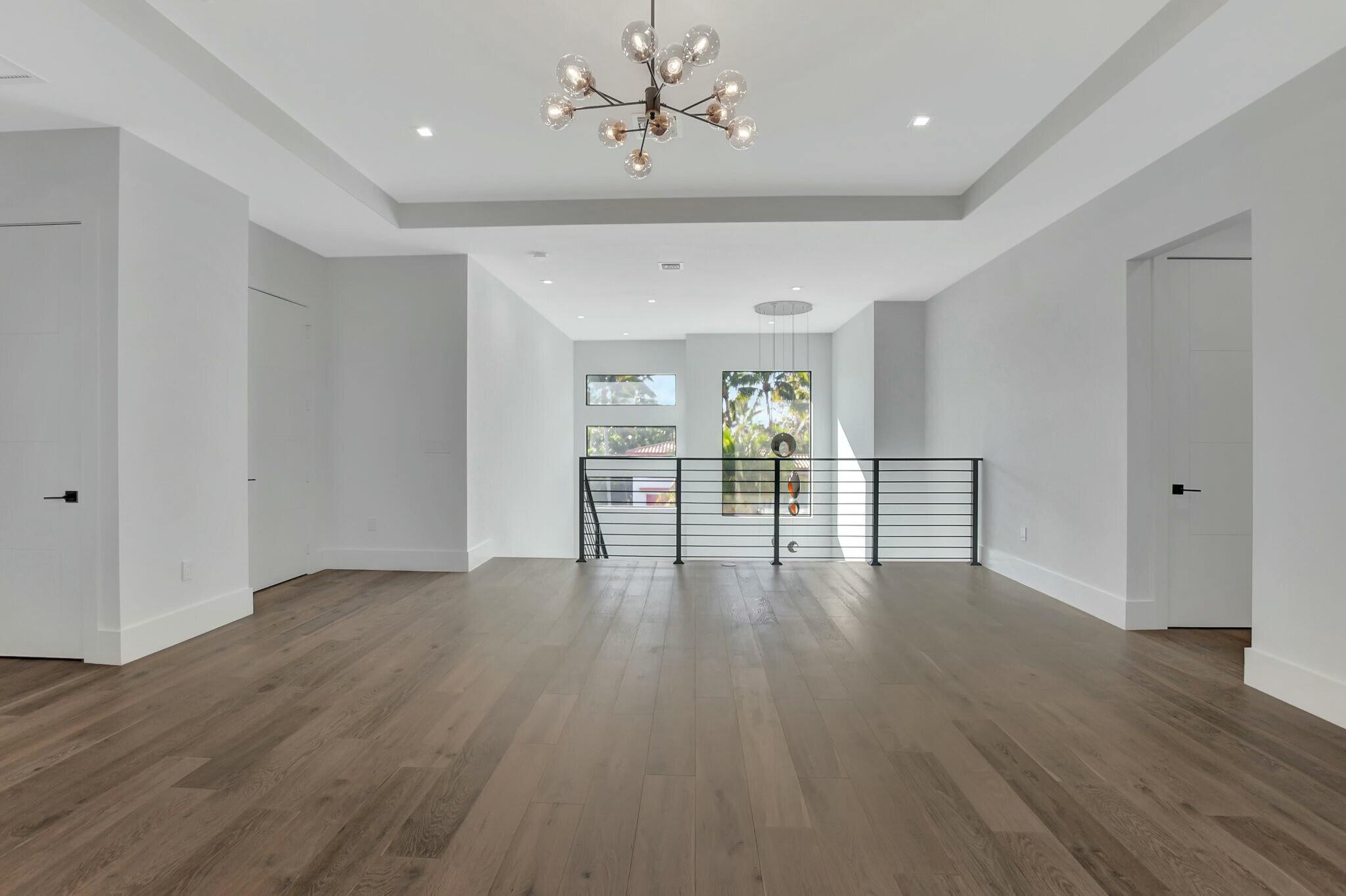 1470 Northeast 4th Avenue Boca Raton, FL 33432 - Photo 48 of 86 a view of an empty room with wooden floor and a window