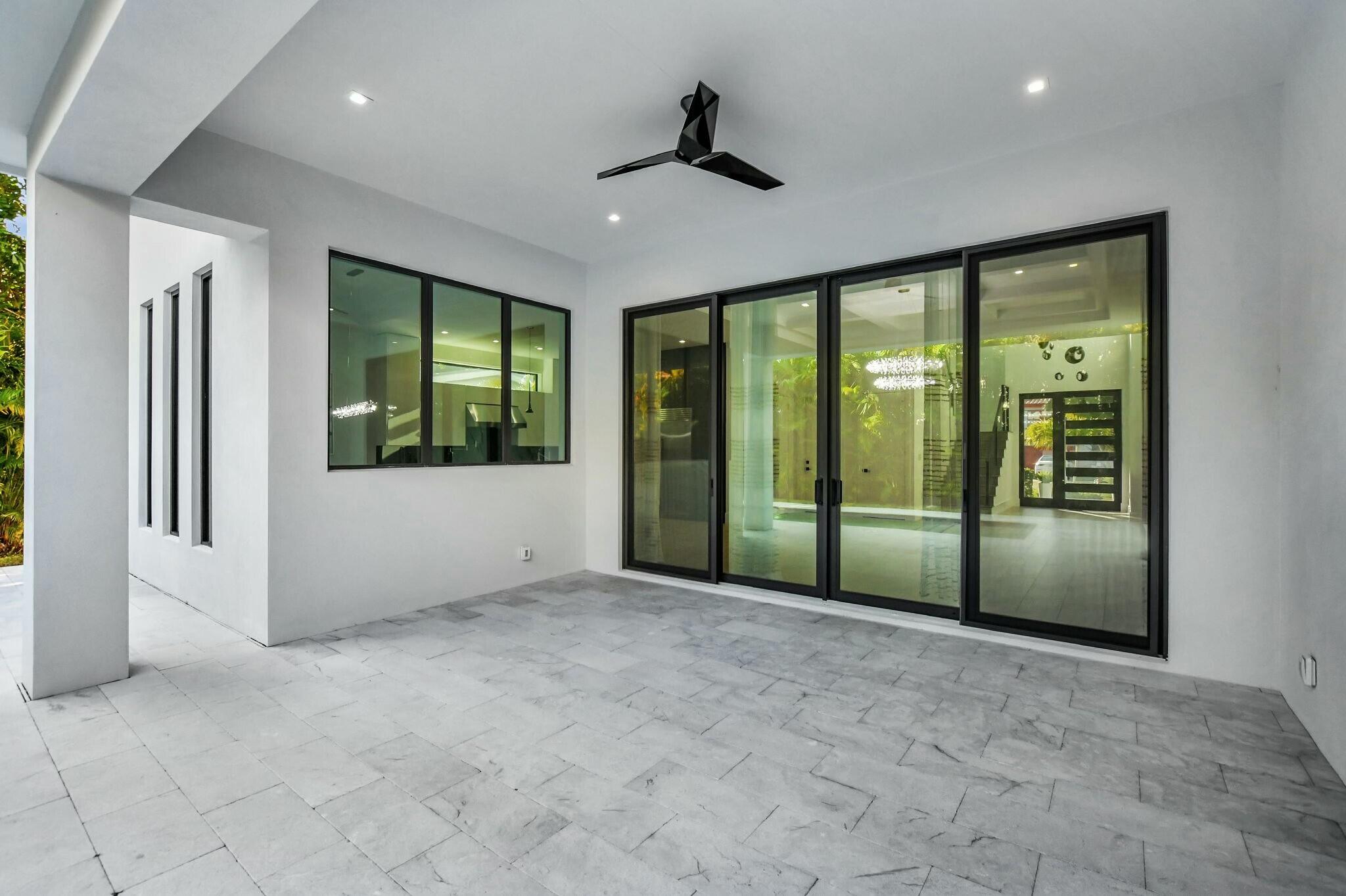 1470 Northeast 4th Avenue Boca Raton, FL 33432 - Photo 67 of 86 a view of an empty room with wooden floor and a window