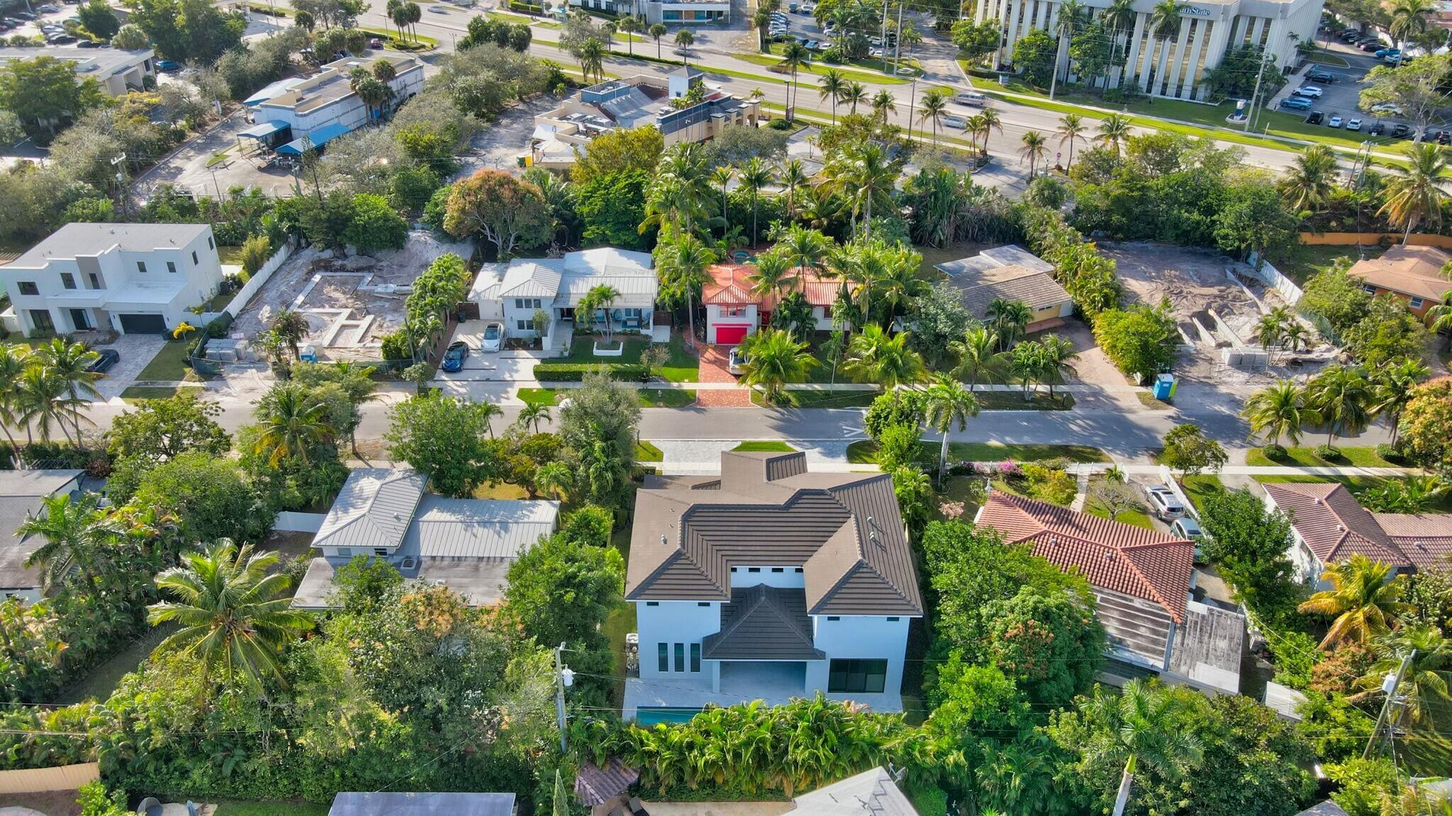 1470 Northeast 4th Avenue Boca Raton, FL 33432 - Photo 83 of 86 an aerial view of residential houses with outdoor space and swimming pool