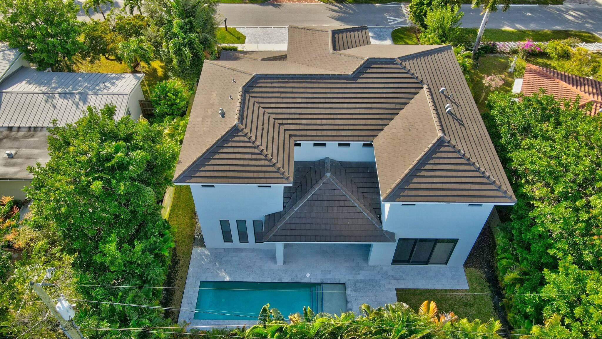 1470 Northeast 4th Avenue Boca Raton, FL 33432 - Photo 84 of 86 a front view of a house with a garden