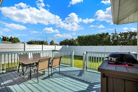 a view of sitting area with furniture and wooden floor